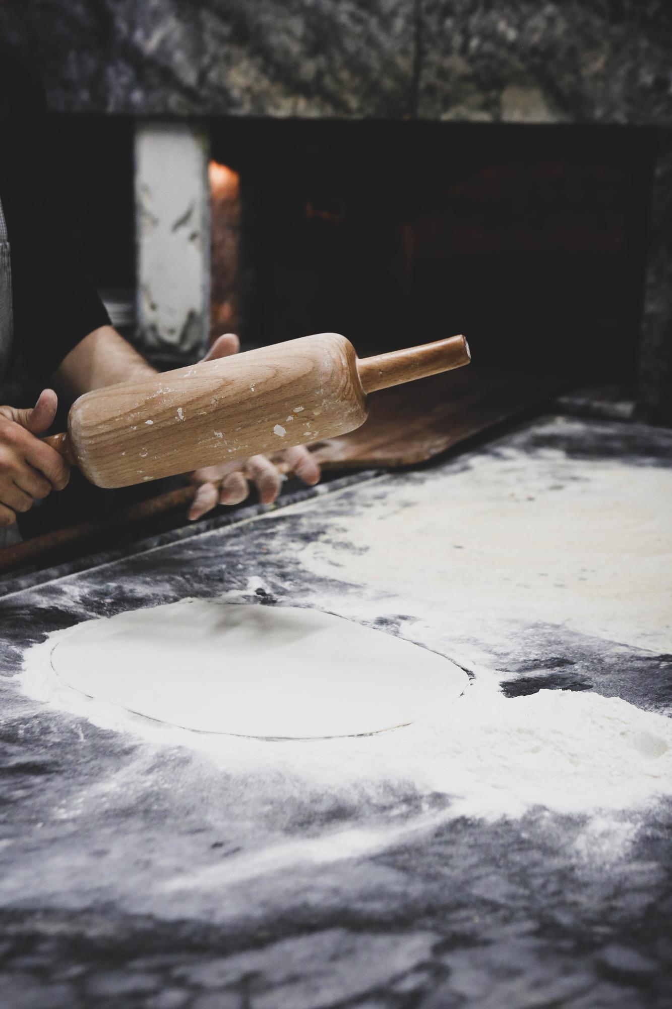 hands shaping dough in studio